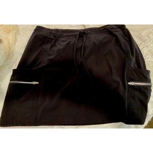 Black Skort With Side Pockets And Silver Zippers
